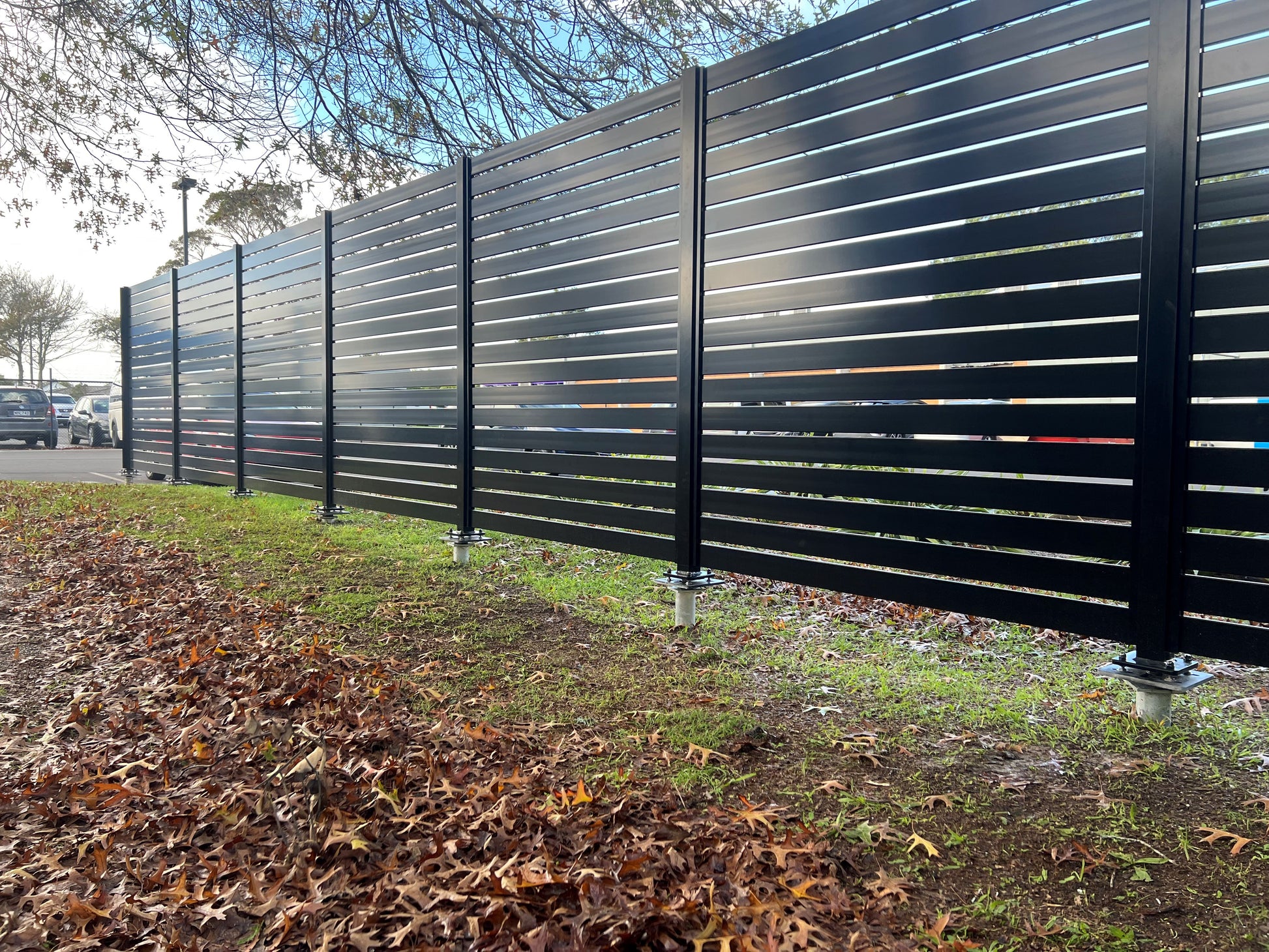 Aluminium Slat screen fencing on J Vice ground screws_ less digging