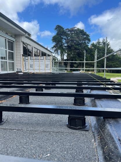 Aluminium Framed pedestal deck Pukekohe Golf Club Auckland with composite decking installed by Pukekohe builders. Aluframe New Zealand's number one timber and composite subframe.
