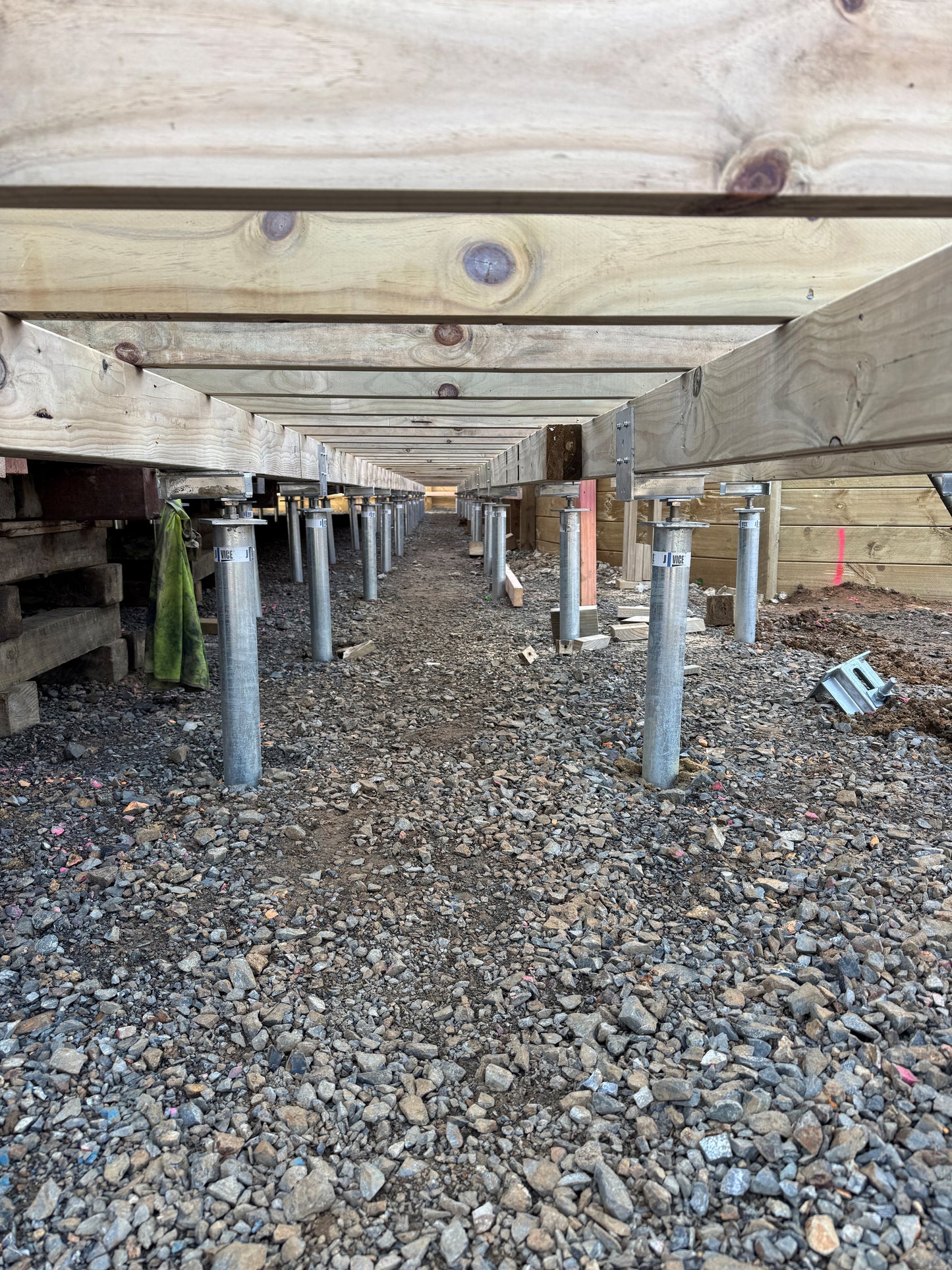 Ground screws installed to hold up a portable classroom for a school