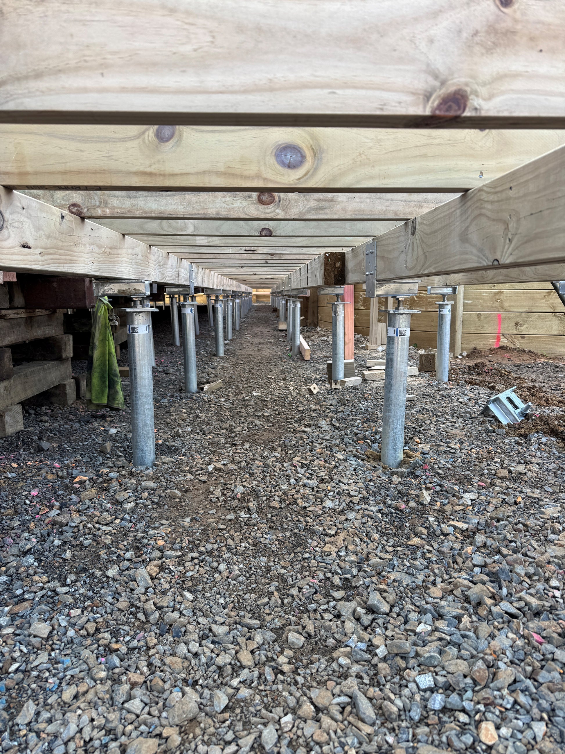 Ground screws installed to hold up a portable classroom for a school